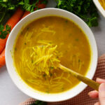 a bowl of soup overhead with noodles