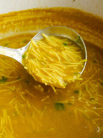 soup being poured in pot