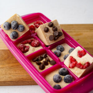 frozen pancake batter in pink ice cube tray