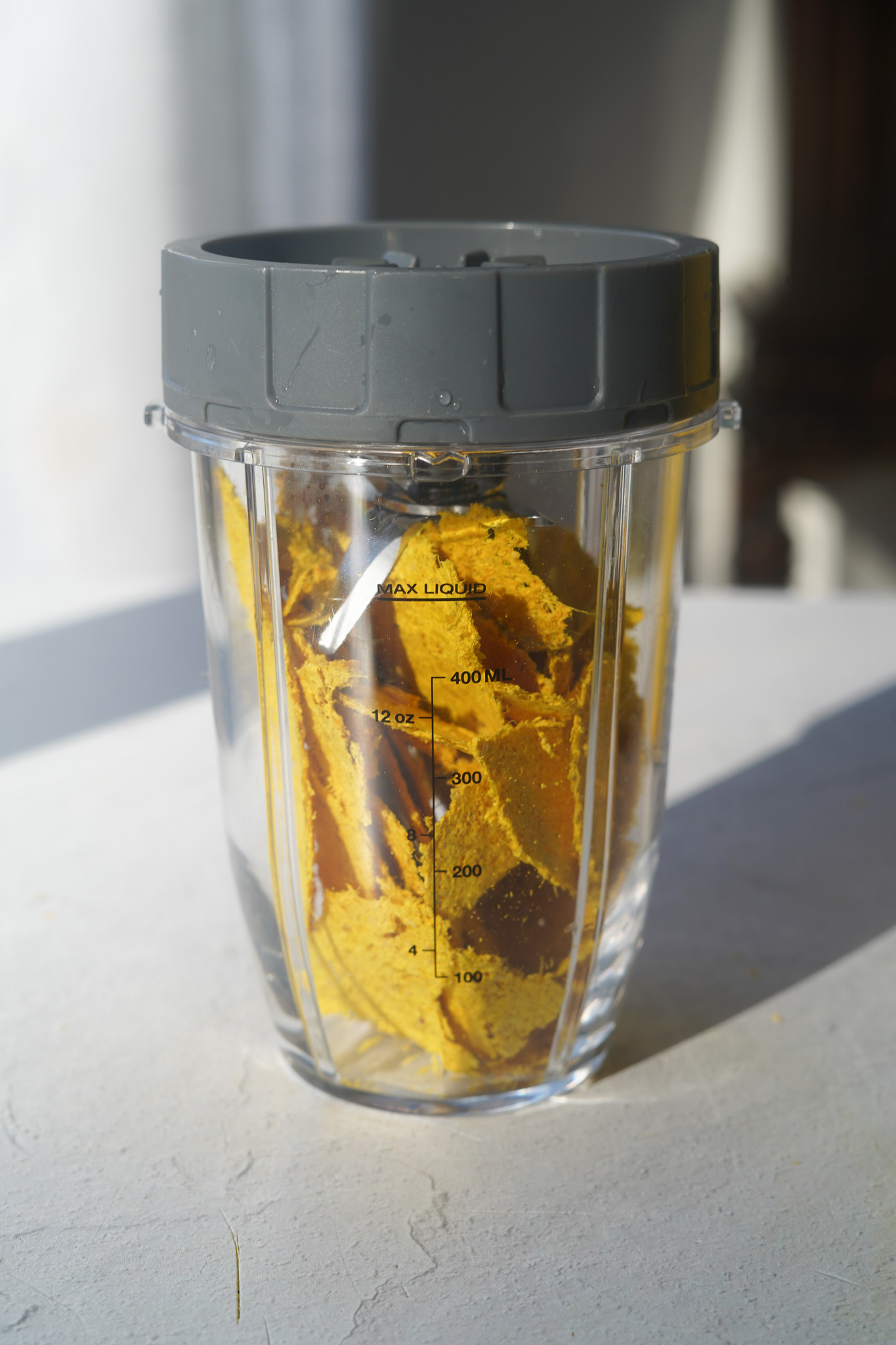 Ginger Turmeric Spice in a blender on a white countertop