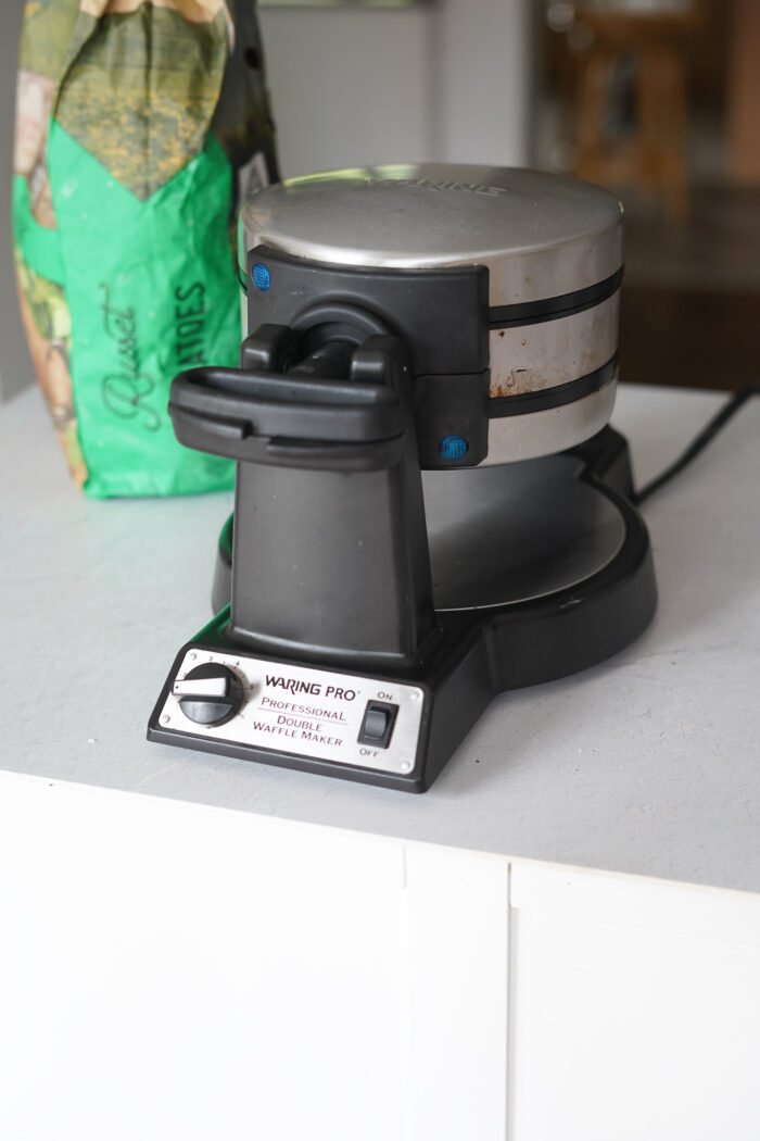 hash browns made in waffle maker kitchen hack Stock Photo - Alamy