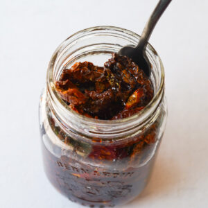 sun dried tomatoes open in a jar