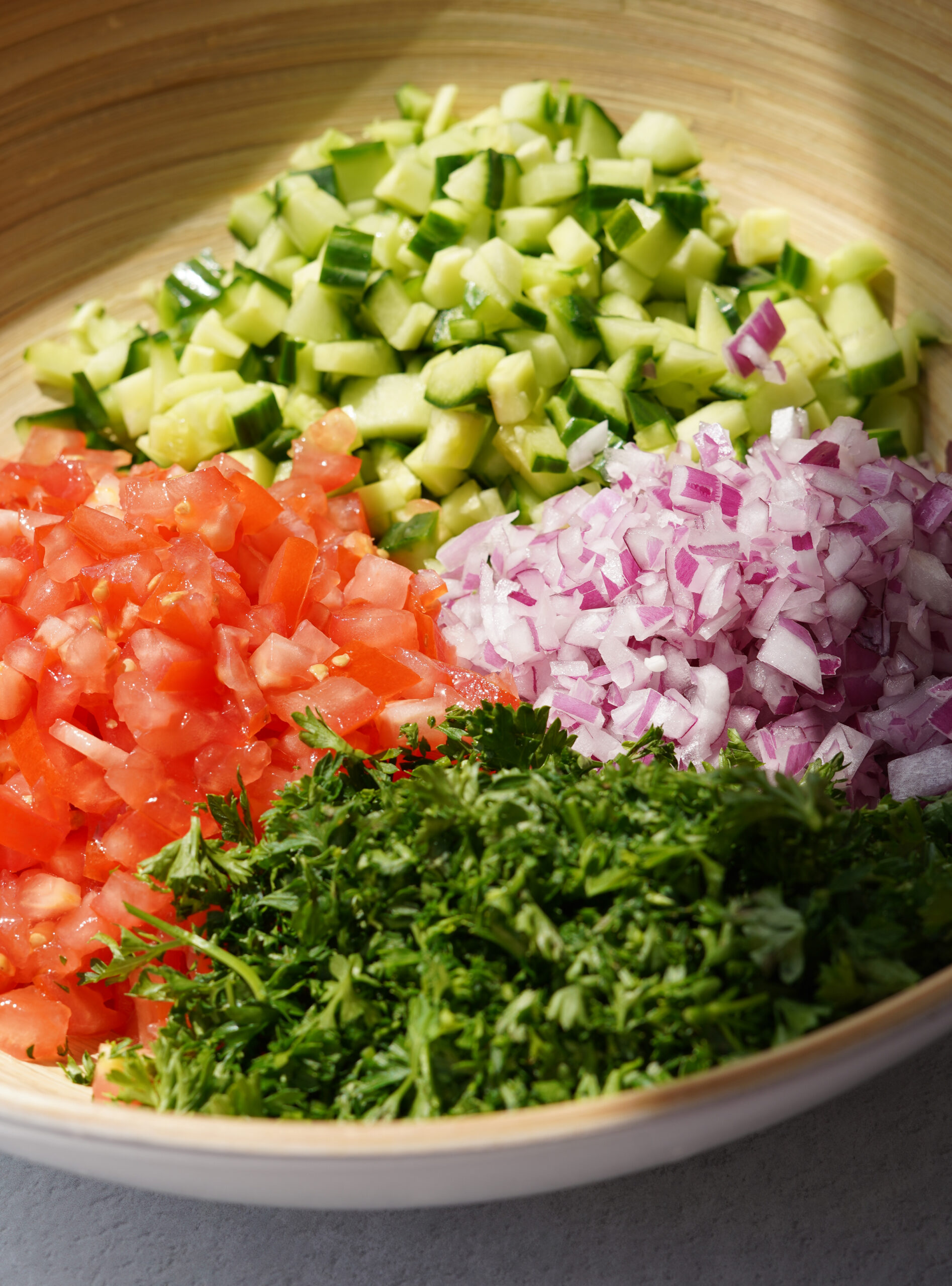 shirazi salad ingredients together in a mixing bowl