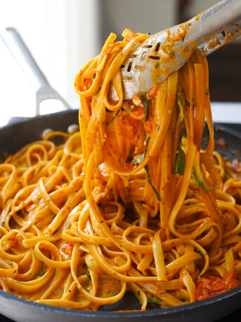 Marry Me Pasta with a portion lifted out of the pan