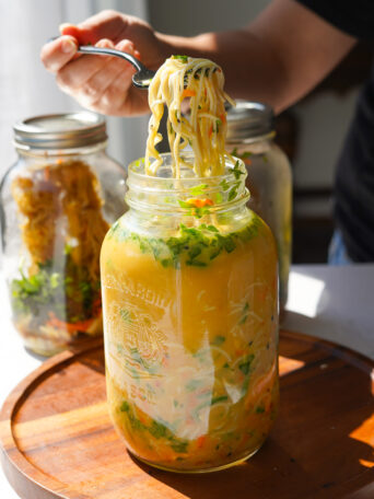 tahini ramen jar displayed when cooked with meal prep jars in the background