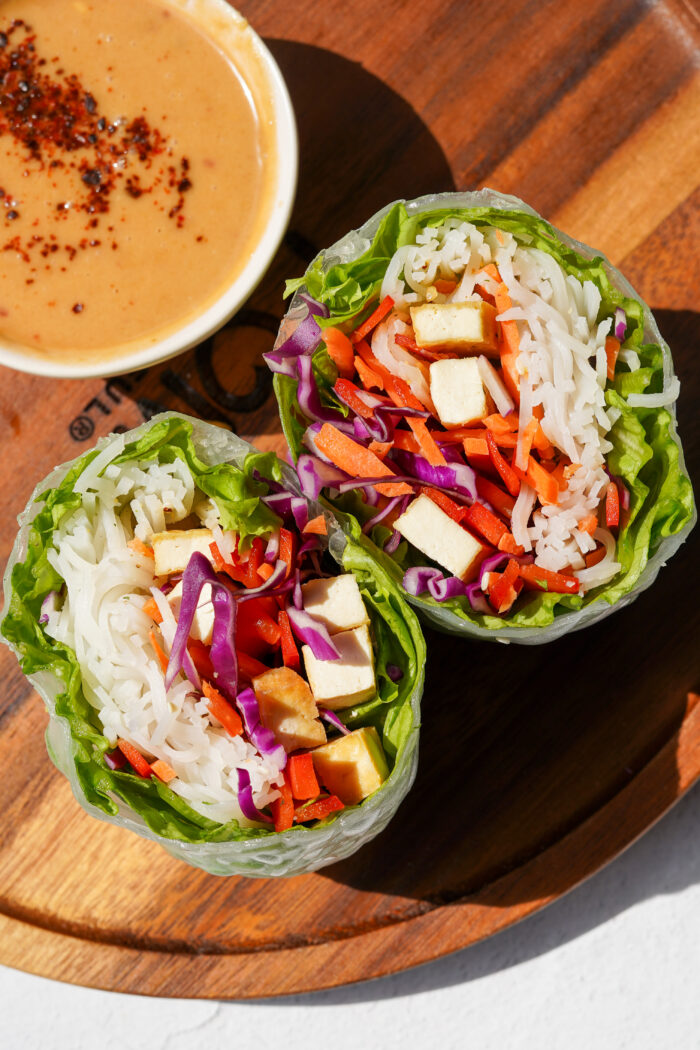 giant spring rolls top down view served with peanut sauce