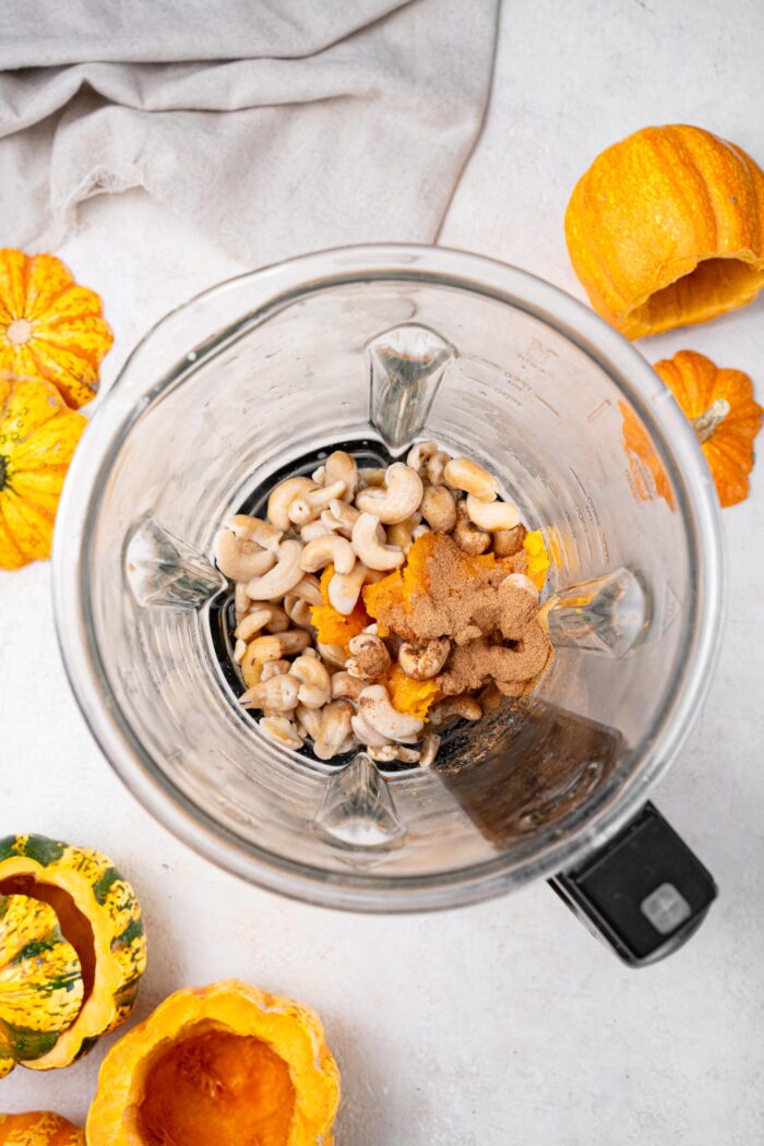 Vegan pumpkin custard ingredients in a blender.