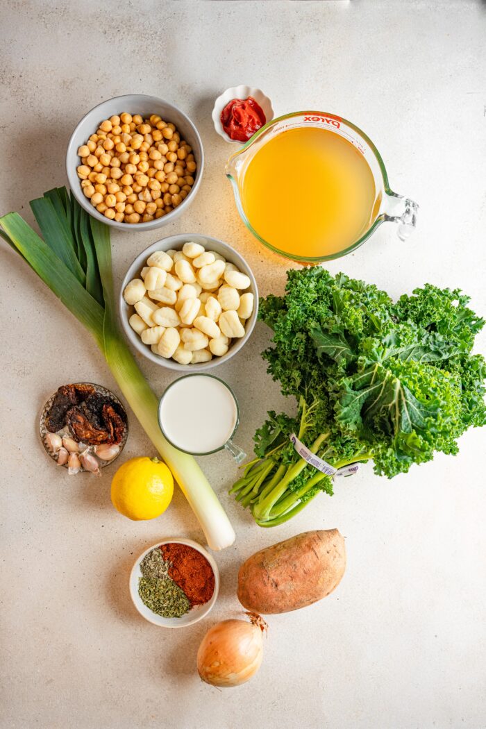 marry me tuscan vegetable soup ingredients laid out on a light background