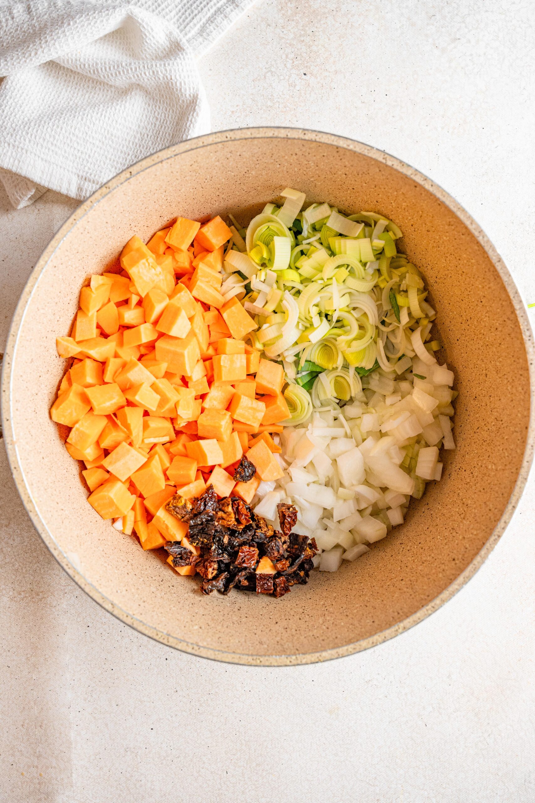 marry me tuscan vegetable soup ingredinets in a pot