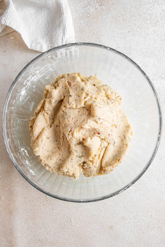 Potato pops "dough" in a glass bowl on a light background.