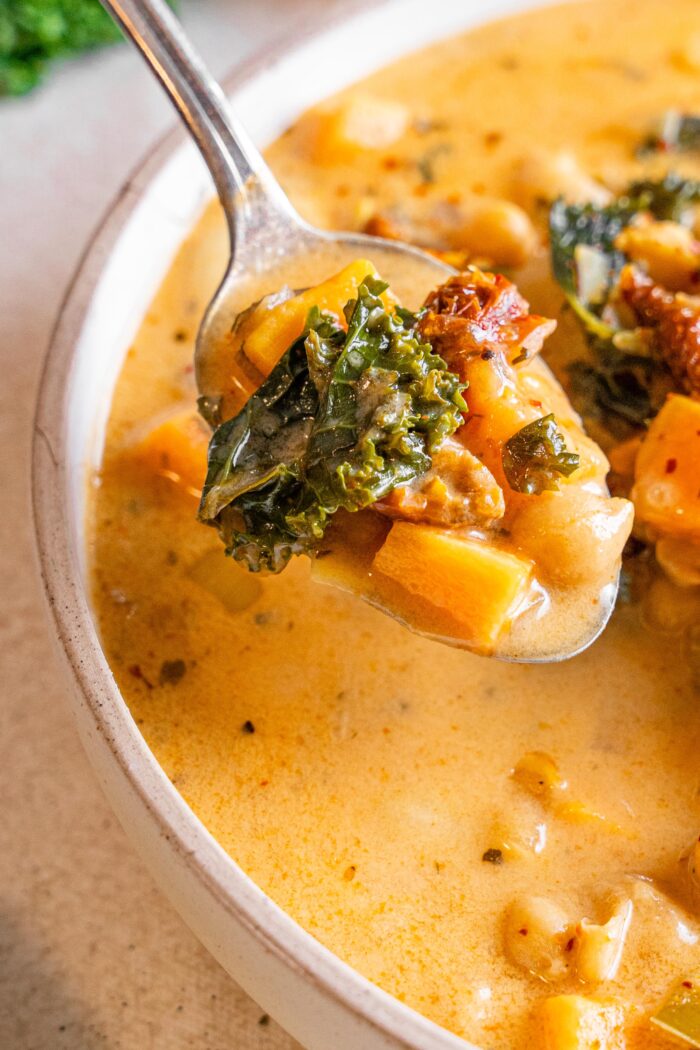 marry me tuscan vegetable soup close up on a spoonful