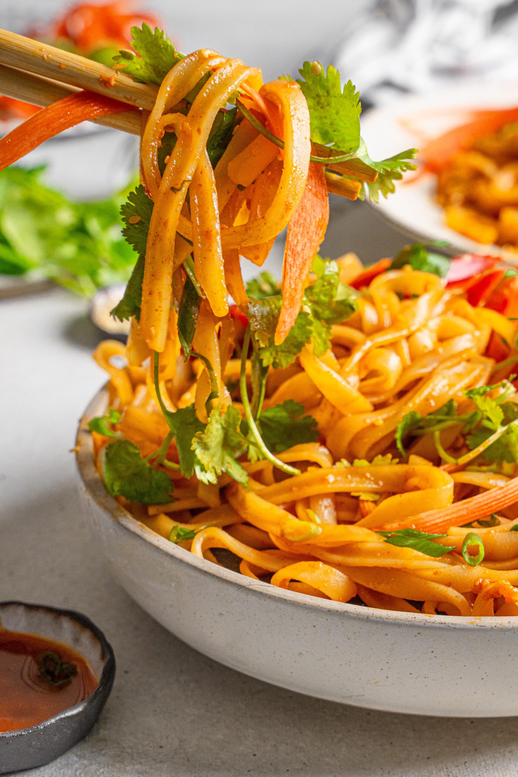 fiery gochujang noodles picked up with chopsticks