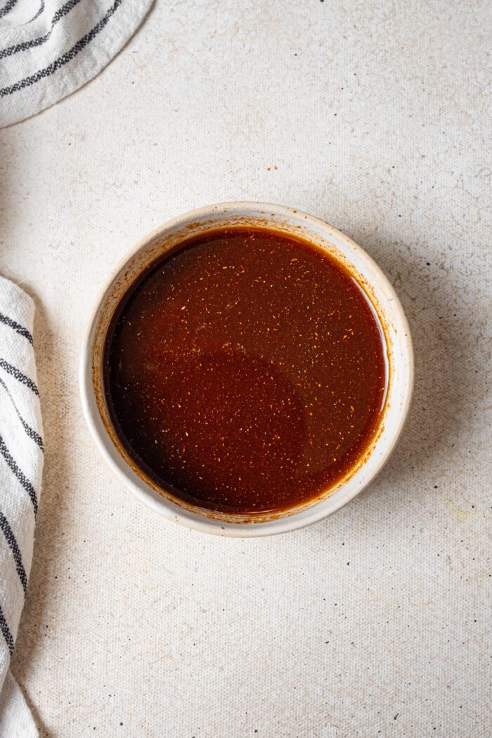 Maple glaze whisked together in a small bowl.
