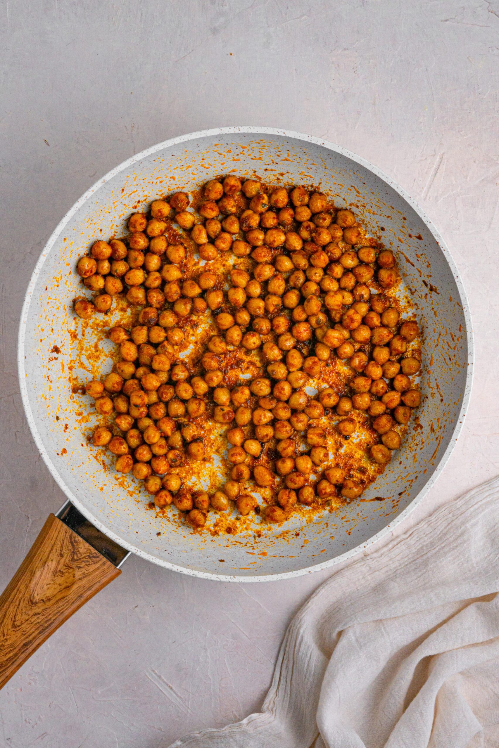 chickpeas and spices cooked in a frying pan