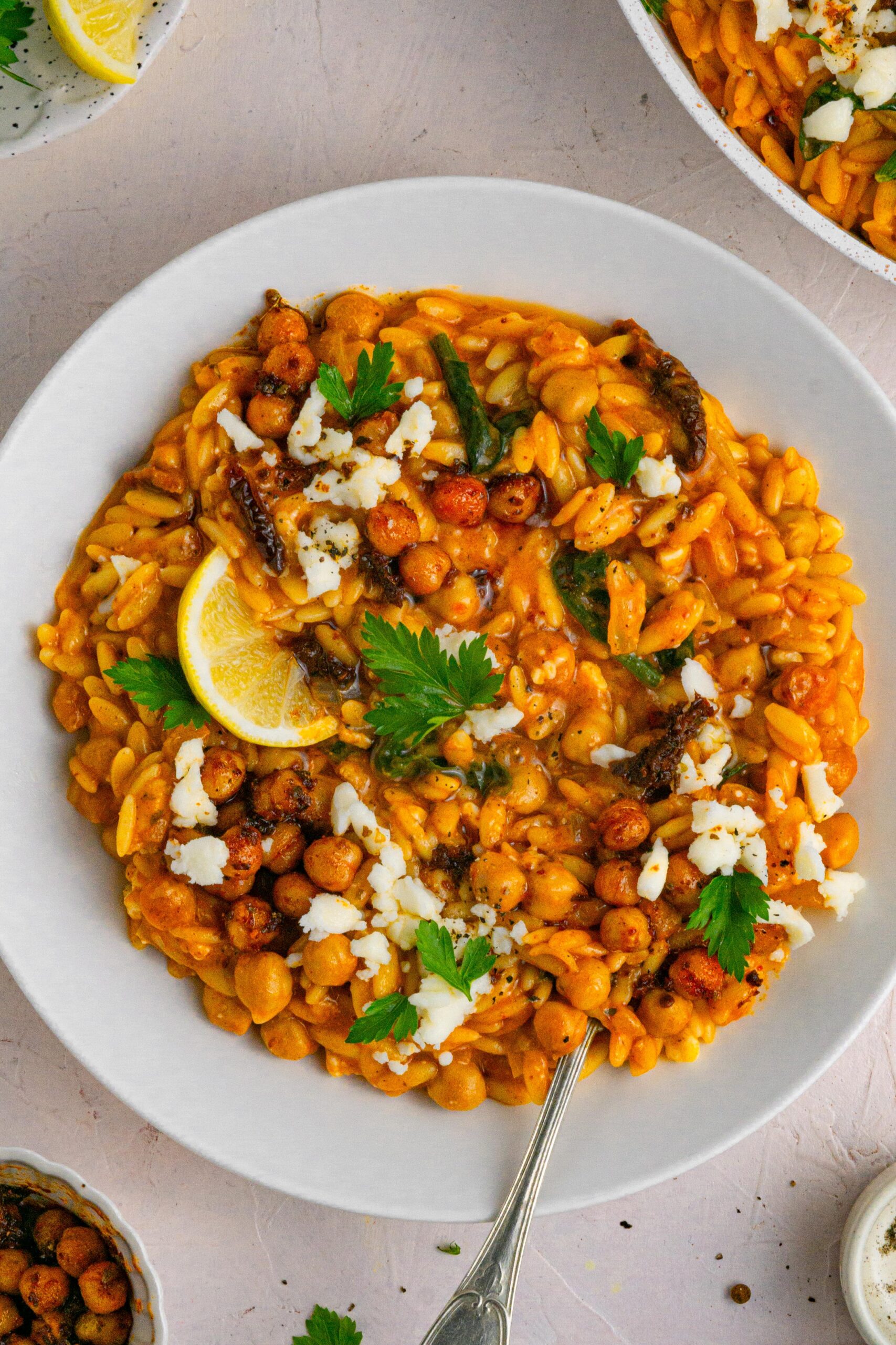 marry me sundried tomato orzo served with vegan feta, parsley and lemon