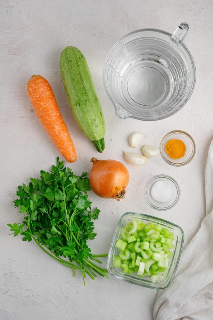 hidden veggie broth ingredients laid out on a light background