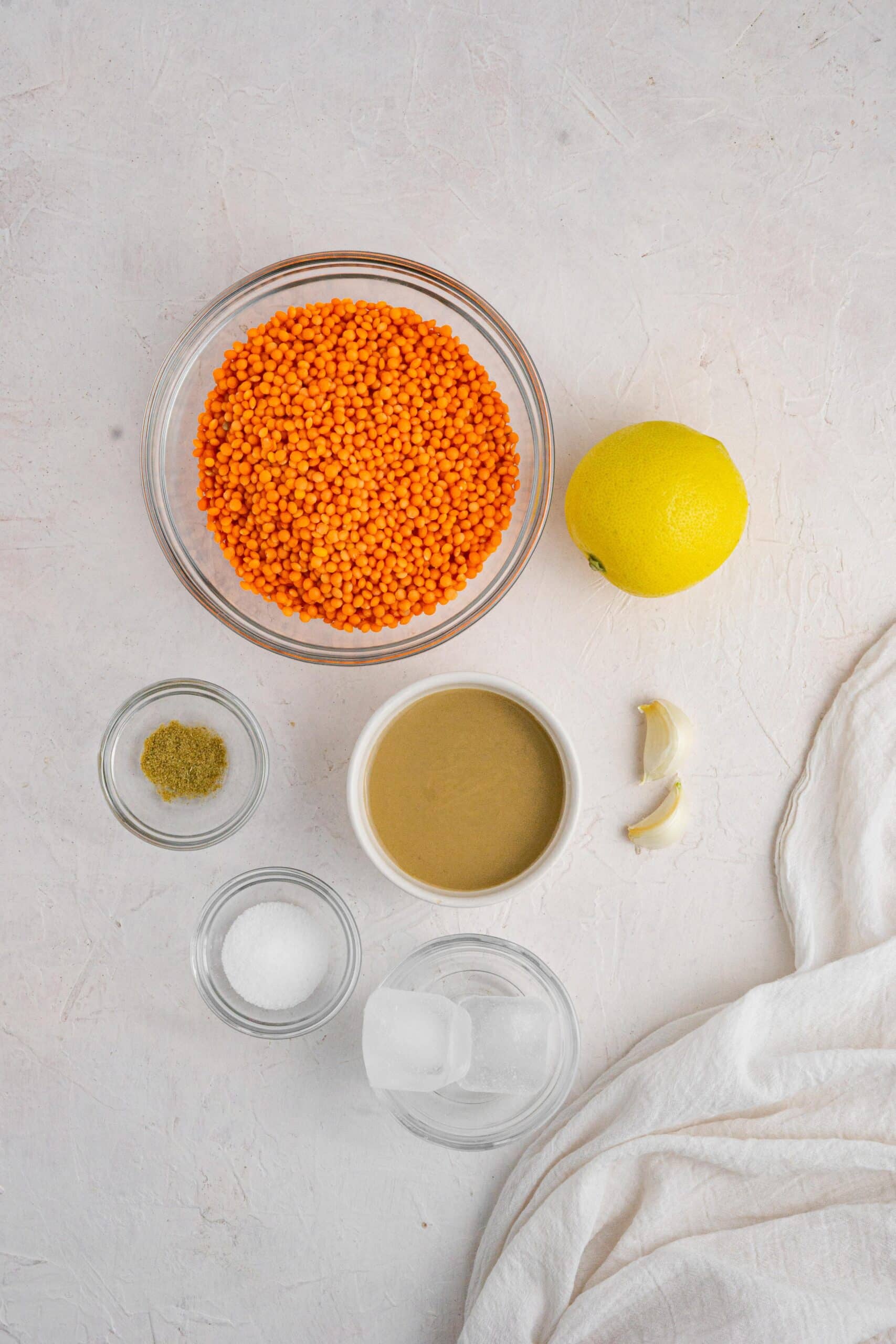 red lentil hummus ingredients on a white background