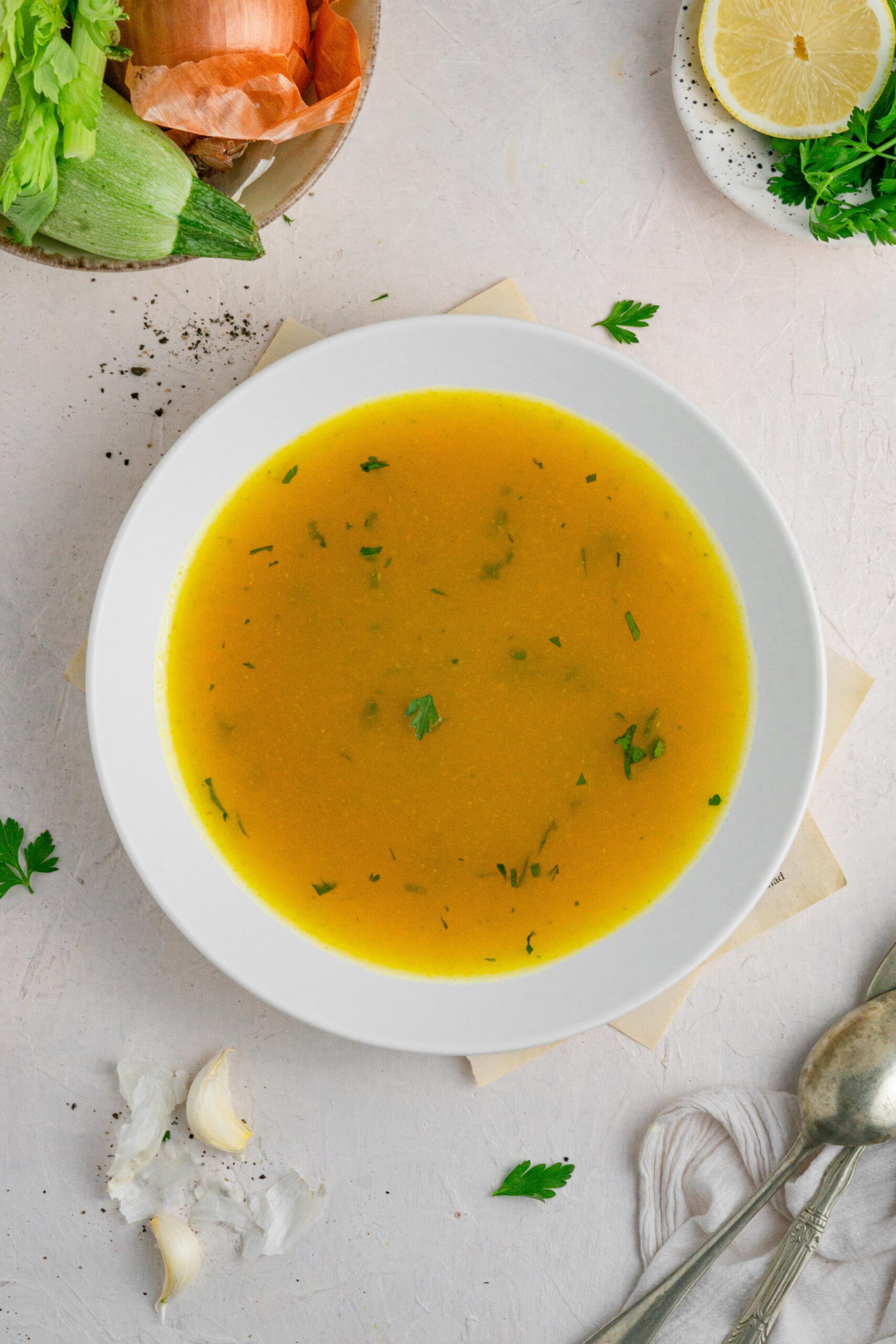 hidden veggie broth in a white bowl top down