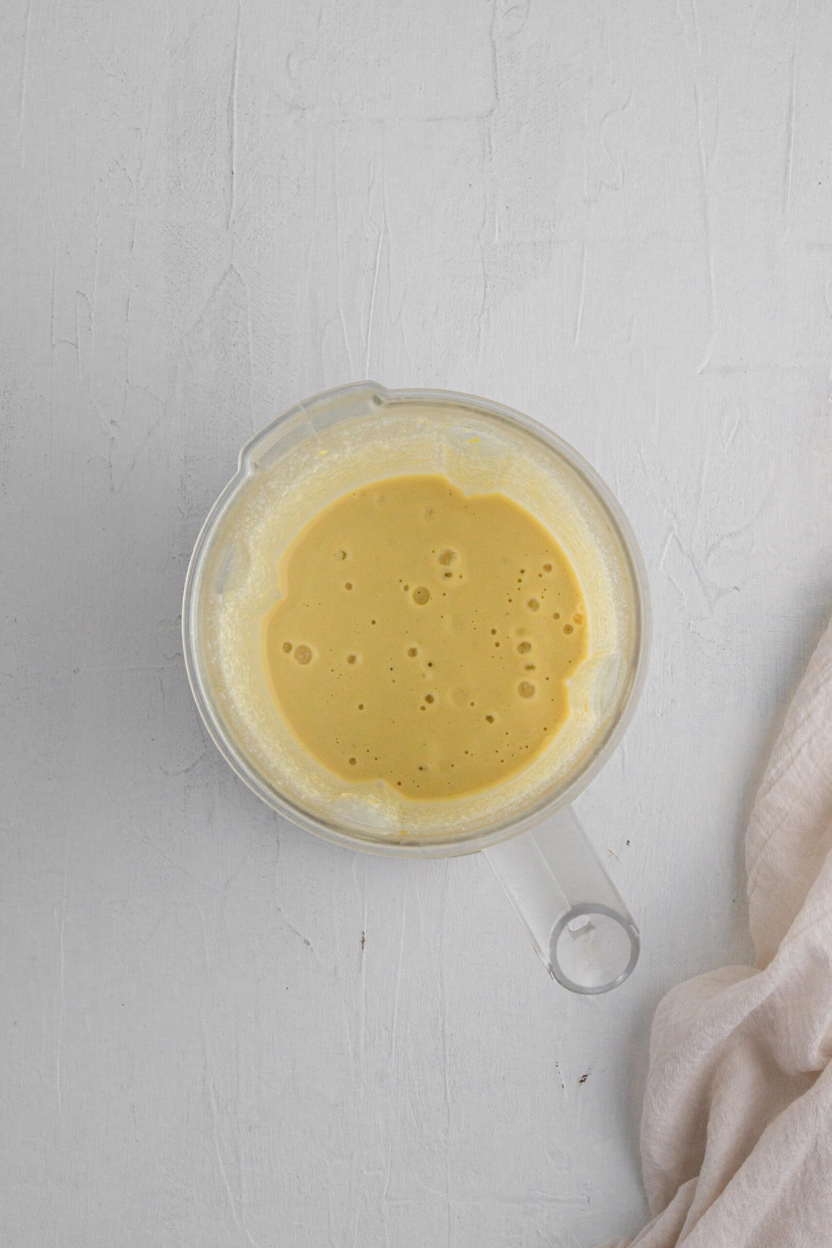 healthy vegan mayonnaise in a blender cup