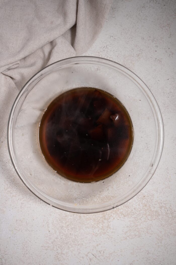 Glass bowl with chocolate and coffee.