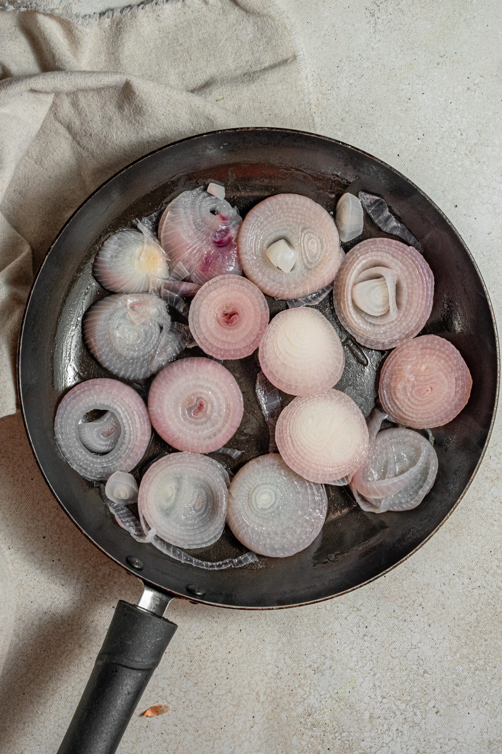 cooked red onions in a frying pan