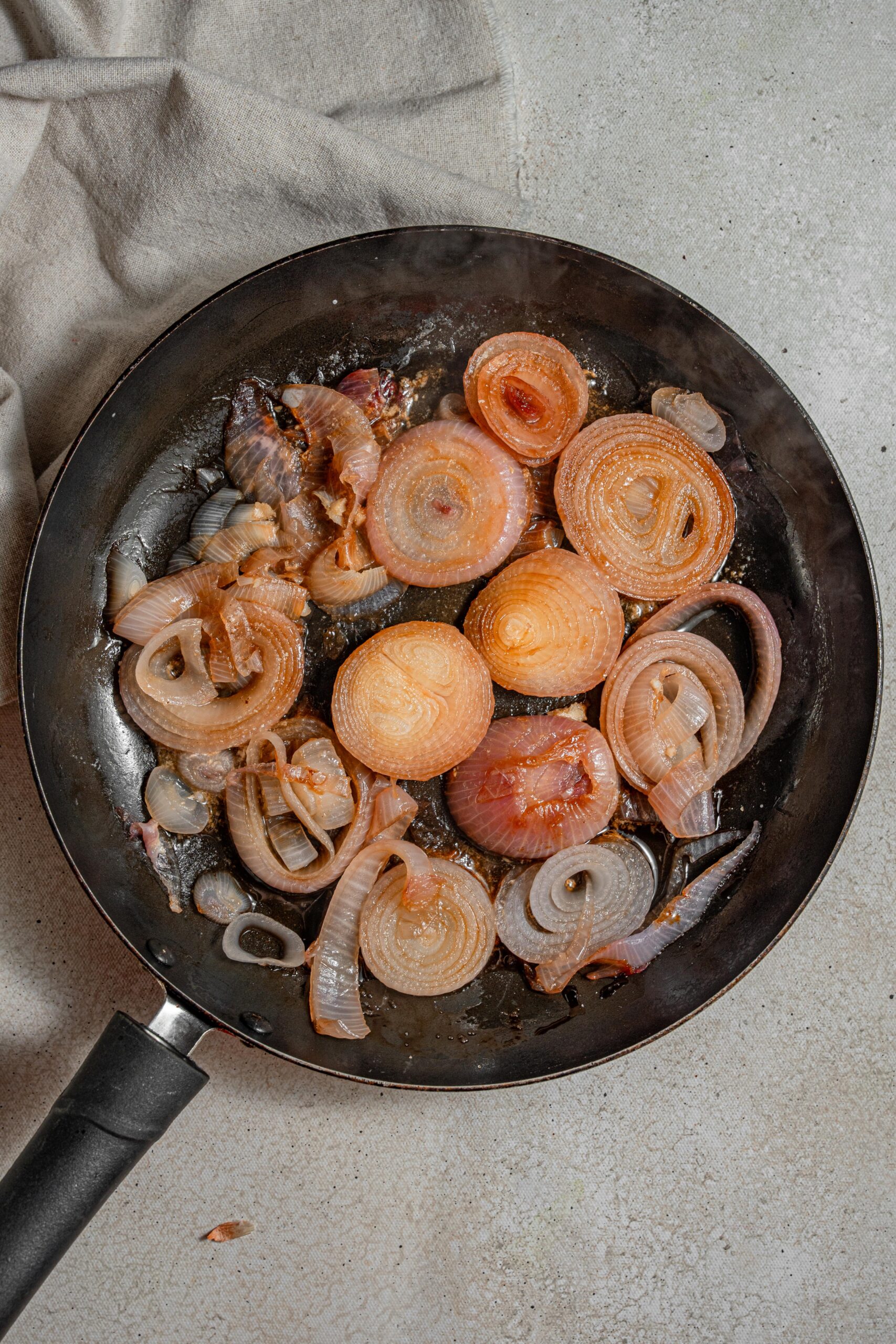 caramelized red onions in a frying pan