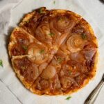 caramelized onion tart sprinkled with some dill