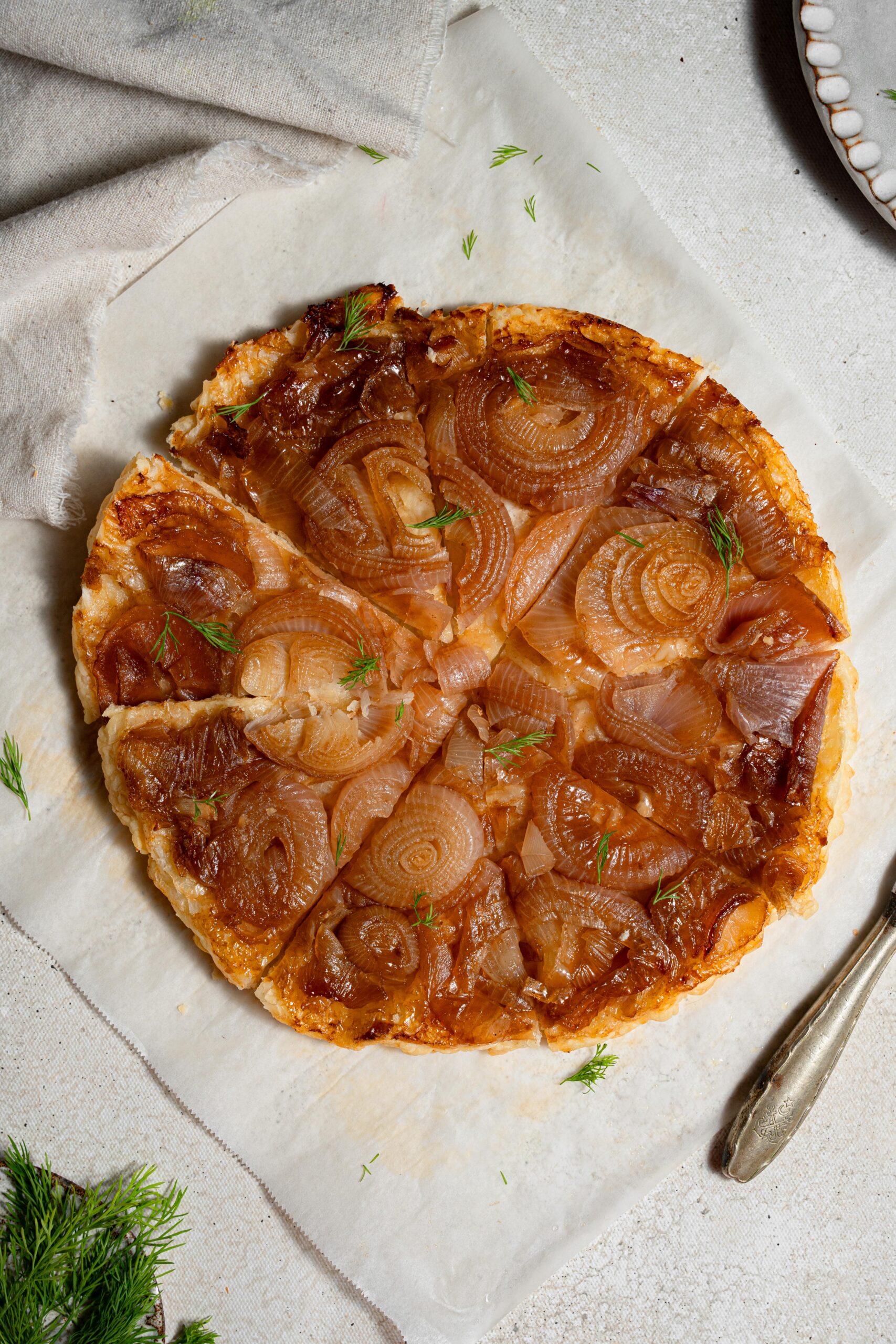 caramelized onion tart sprinkled with some dill