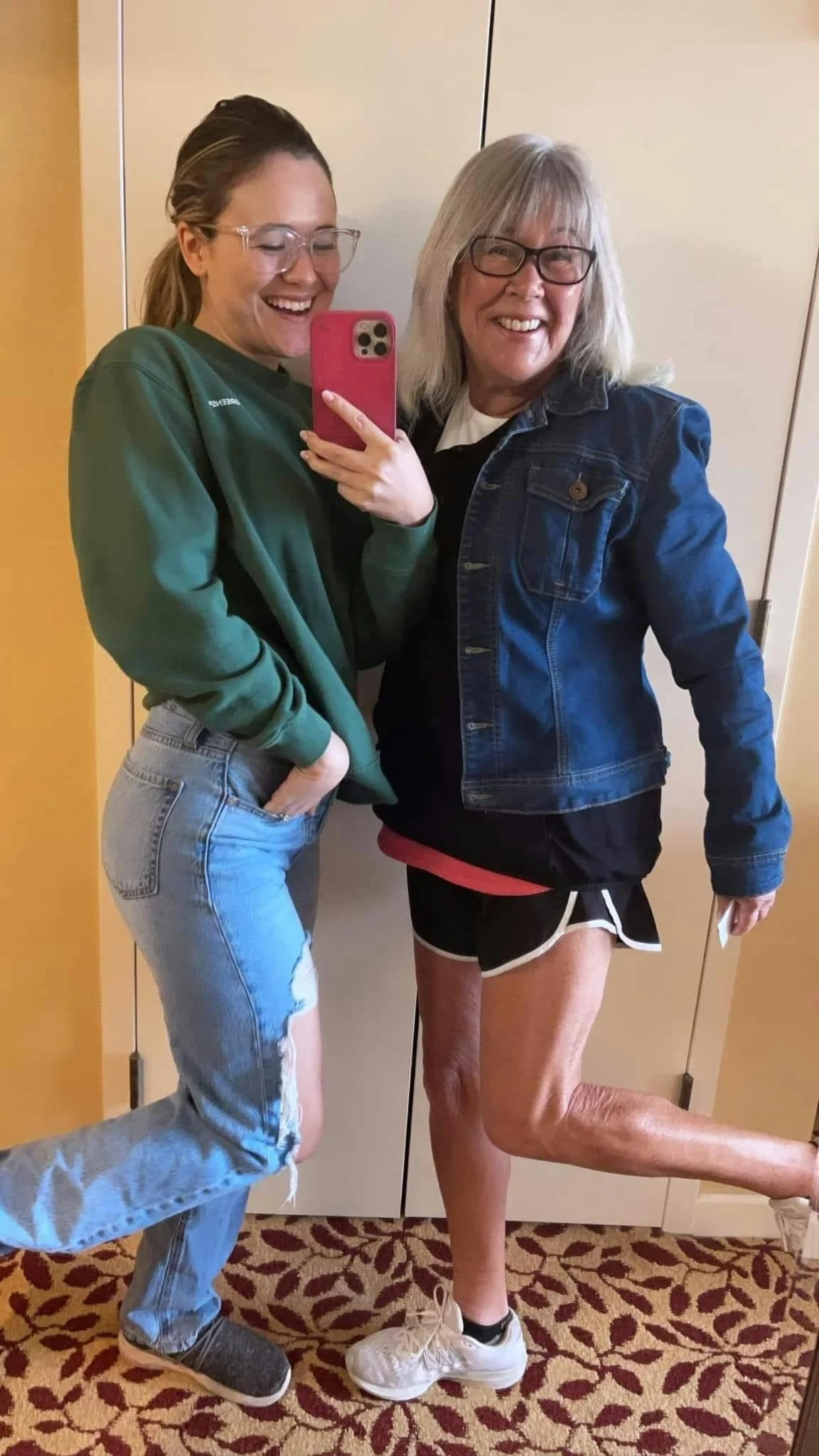 Carleigh and her mom Debbie posing for a mirror selfie and smiling