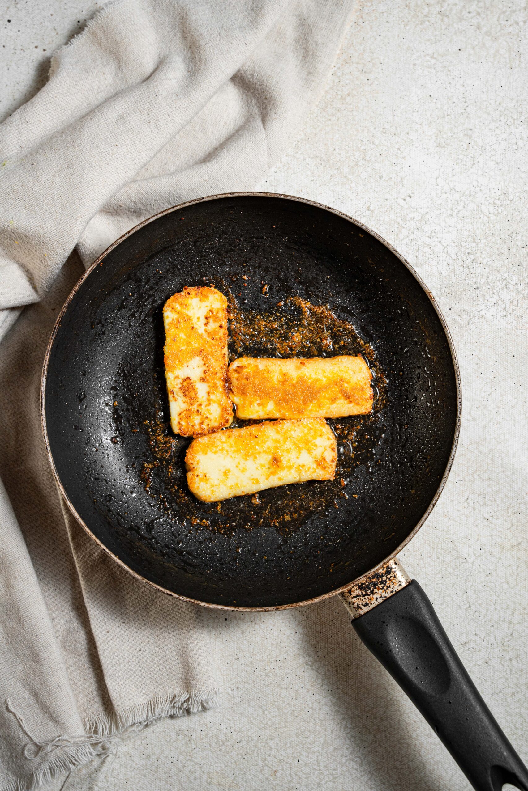 frying pan with crispy fried tofu