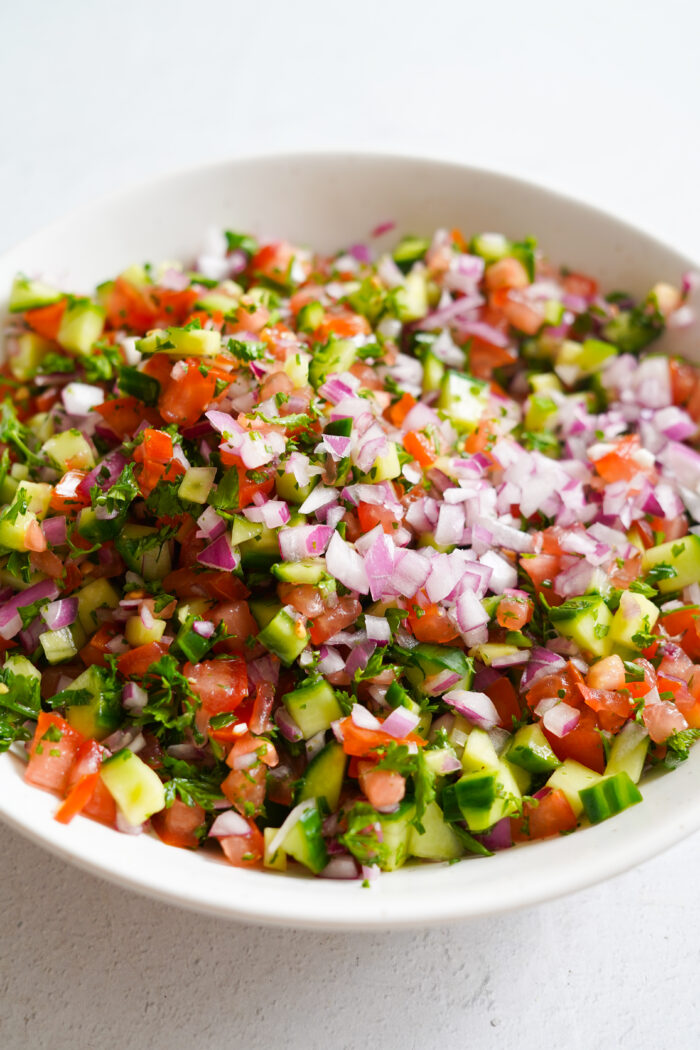 shirazi salad in a white bowl