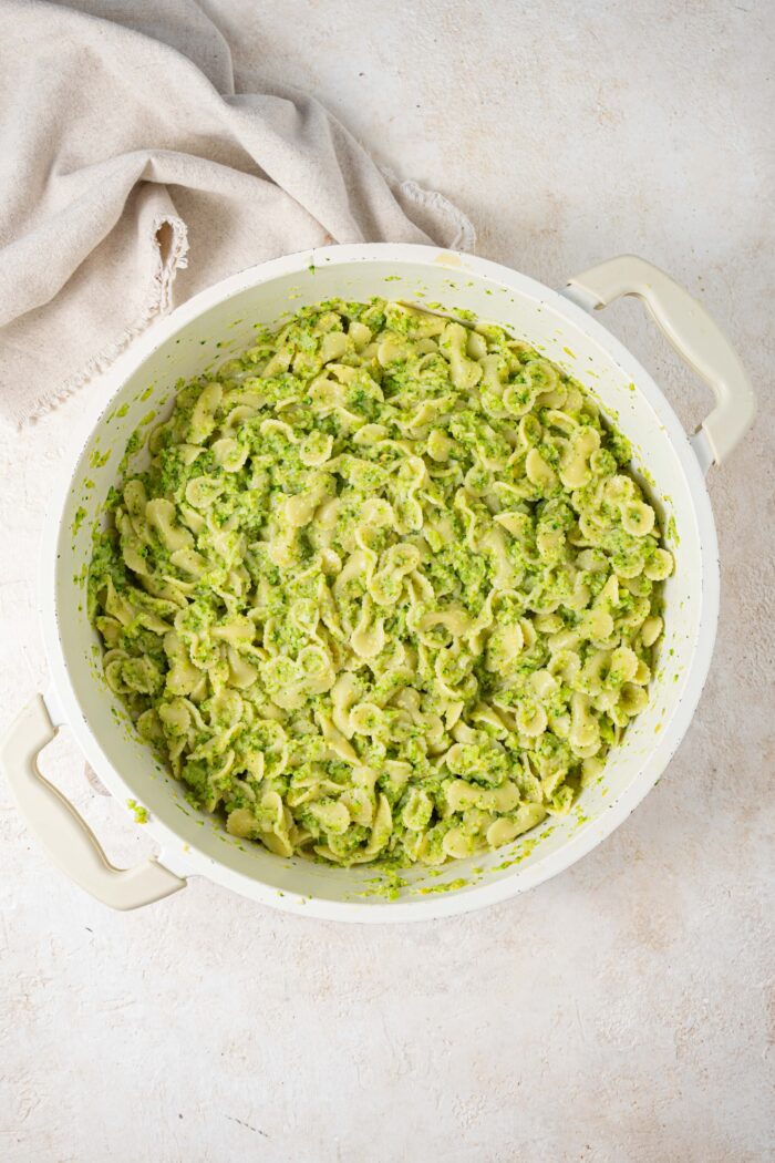 broccoli sauce and cooked pasta mixed together in a pan