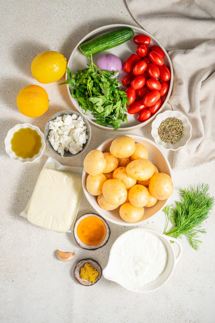 easy greek bowl ingredients potatoes tofu vegetables and vegan yogurt