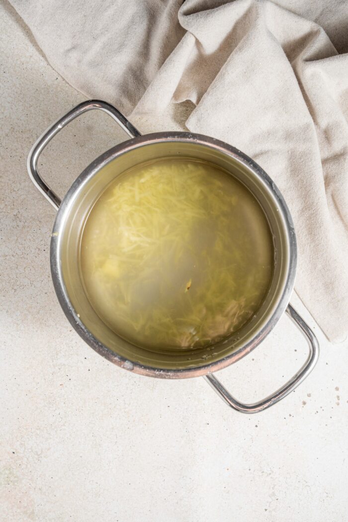 grated ginger and water in a saucepan