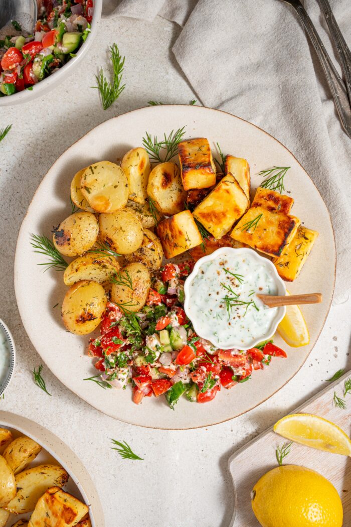 vegan greek bowl served with yogurt dill dressing