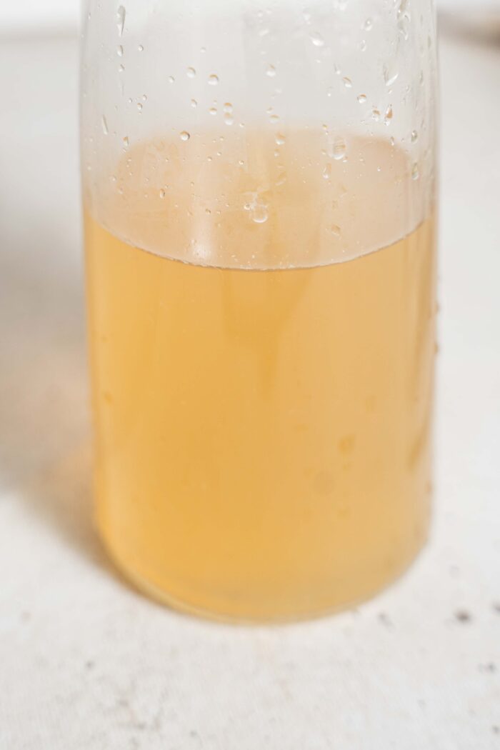 concentrated ginger liquid in a glass carafe