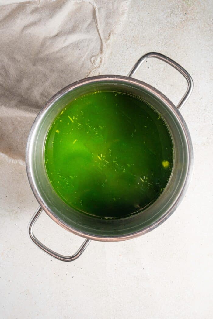 green soup base consisting of blended greens and broth