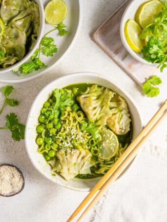 green spring dumpling soup served in a deep ramen bowl with chopsticks