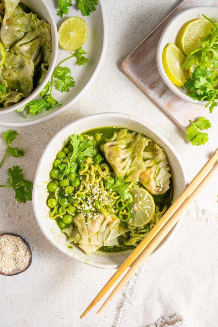 green spring dumpling soup served in a deep ramen bowl with chopsticks