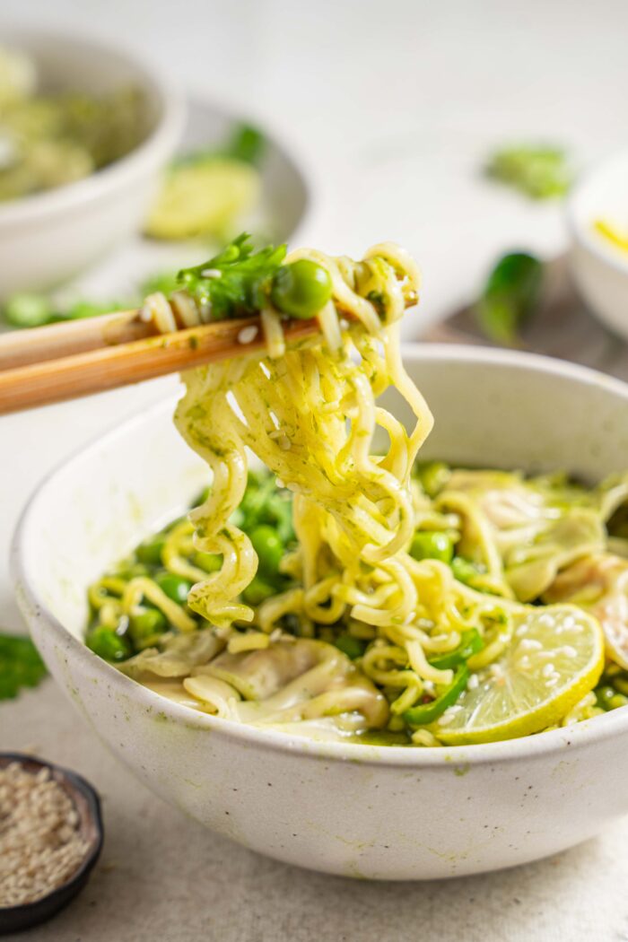 noodles picked up by chopsticks
