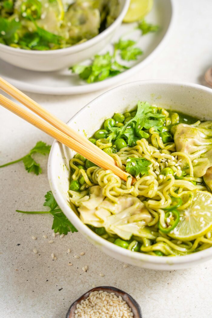 bright light shot of green spring dumpling soup plant-based