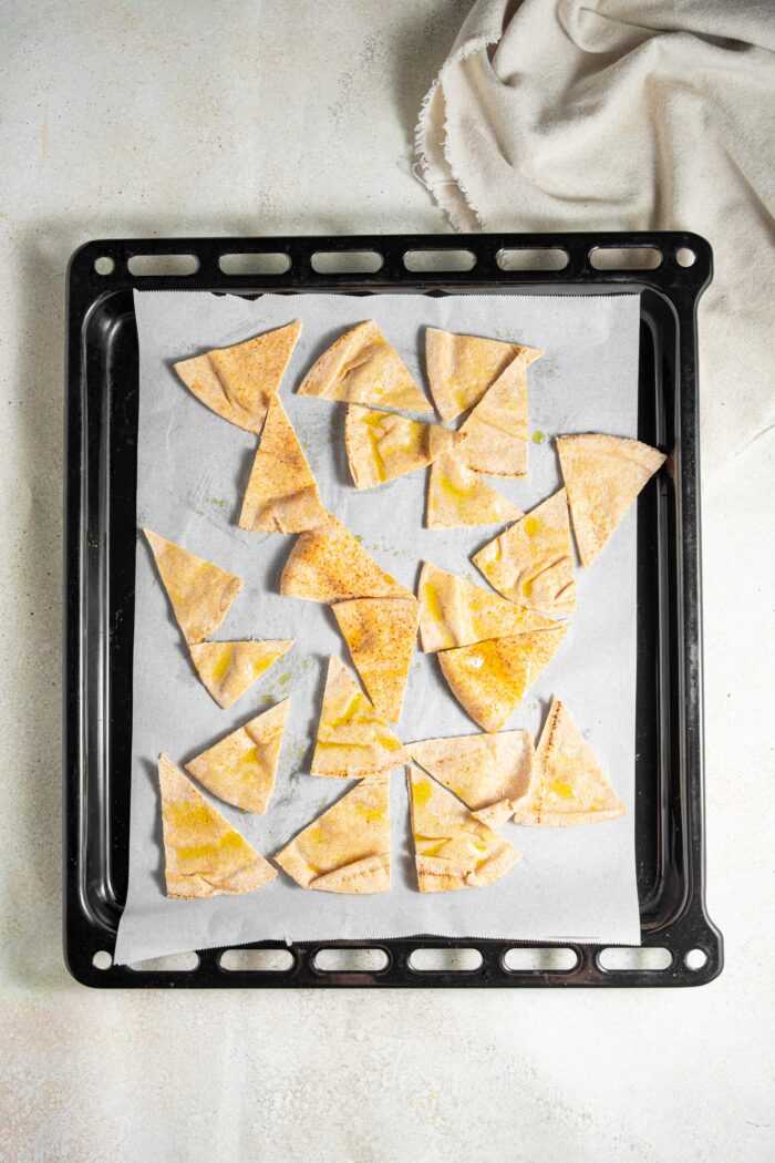 pita bread chips on a baking sheet