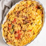 pasta mixed with the vegetables in the casserole dish