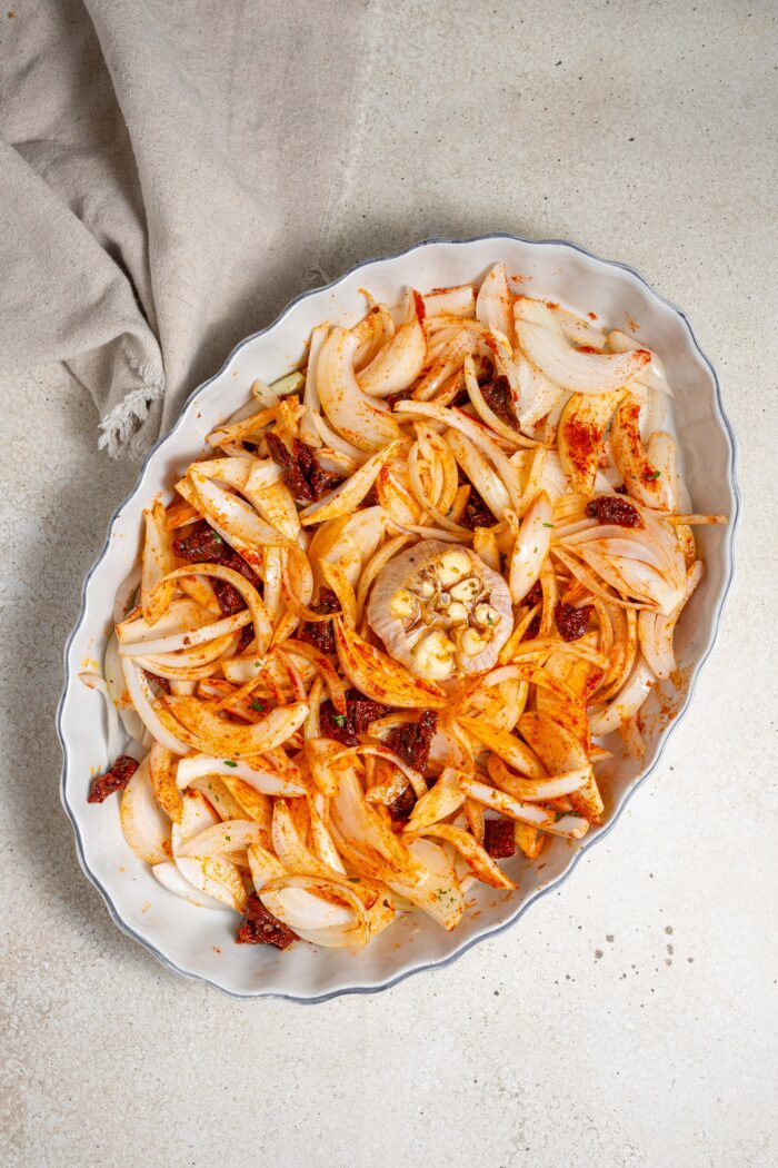onions, garlic, sun dried tomatoes and seasonings in a casserole dish