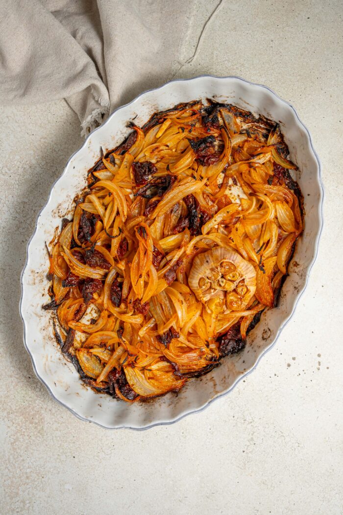 caramelized onions, roasted garlic and sun dried tomatoes in a cassrole dish