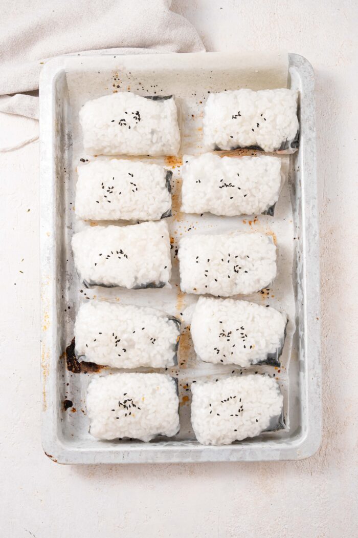 rice paper dumplings wrapped and arranged on a baking sheet