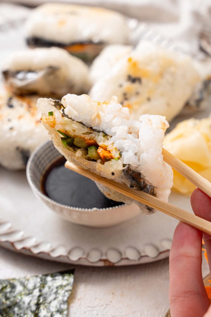 crispy rice paper dumpling with a bite taken out of it