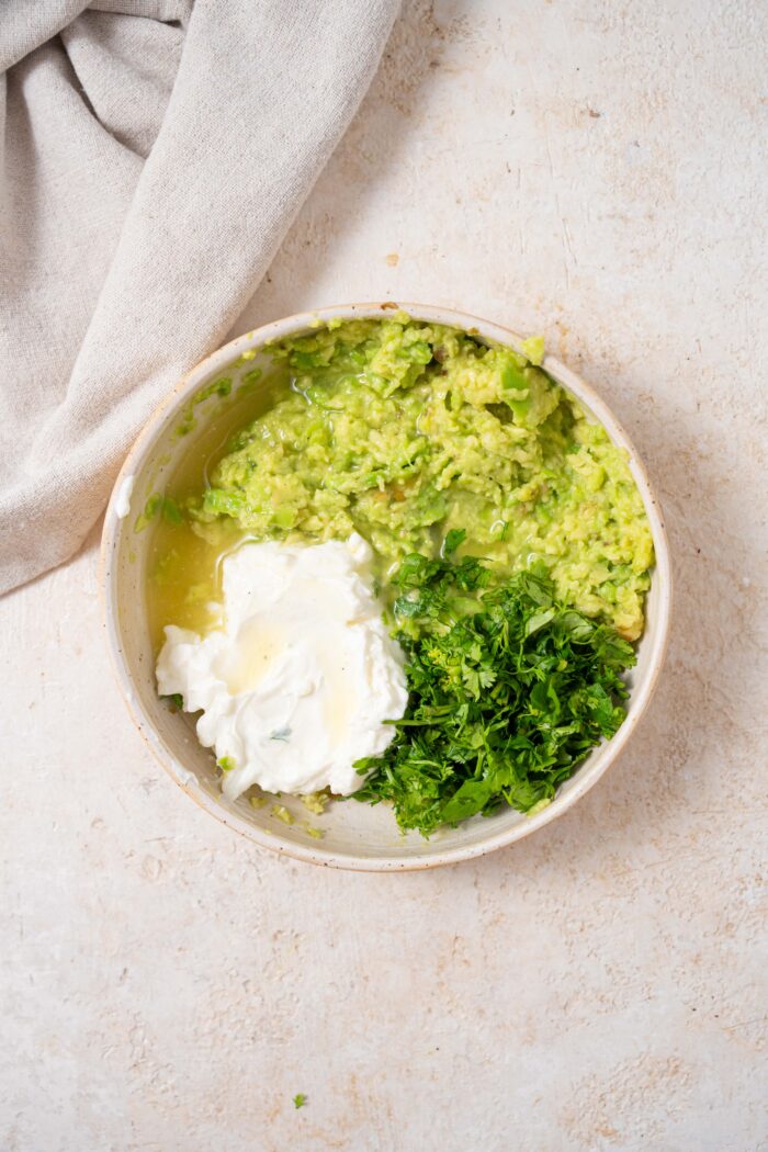 ingredients for avocado crema in a shallow bowl