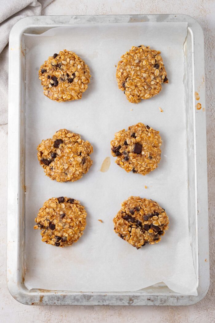 top down view of cookies placed n a lined baking sheet