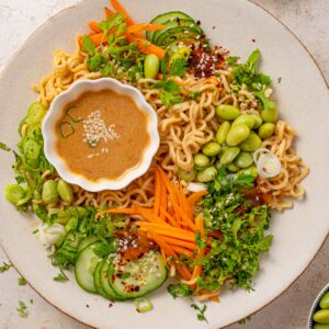 cold sesame noodles served with fresh toppings and extra sauce